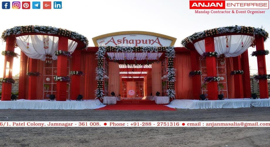 A draped mandap and stage built by Anjan Enterprise at a Jamnagar venue